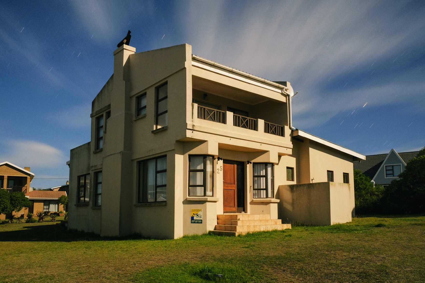 A warm two-storey family home in the late-afternoon sun
